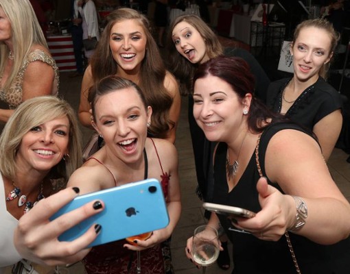 group of women taking a photo
