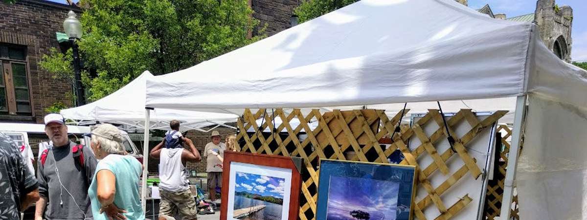 vendor booth with paintings