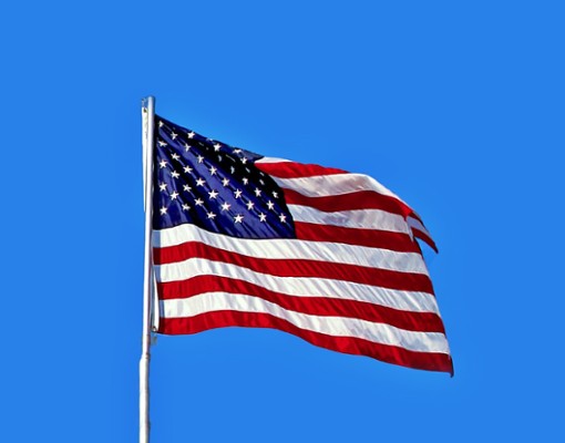 an American flag against blue sky