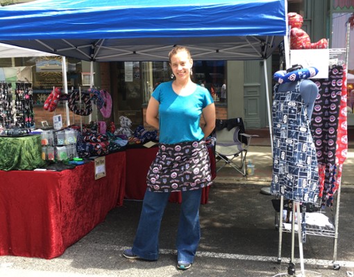 woman in front of vendor booth