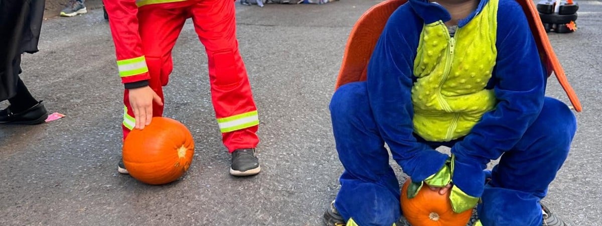 kid dressed as a dinosaur