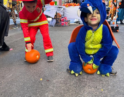 kid dressed as a dinosaur