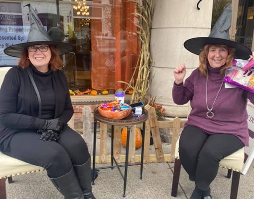 two women with witch hats on