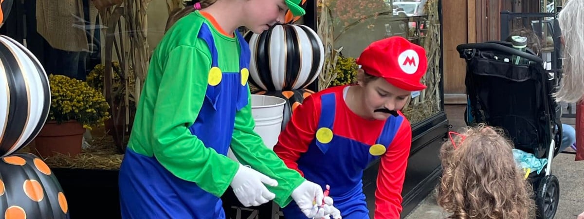 two people dressed as Mario and Luigi