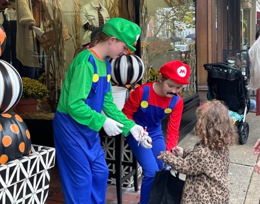 two people dressed as Mario and Luigi