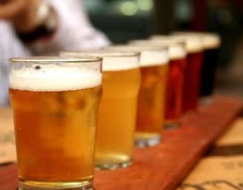 glasses of beer on a counter