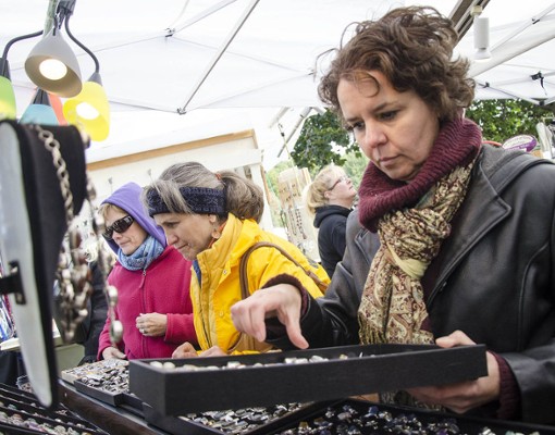 woman looking at box of jewelry
