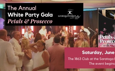 An image of a crowd dancing at a party with a live band and a graphic of a champagne flute being filled with prosecco with a burst of flower petals.
