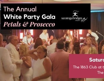 An image of a crowd dancing at a party with a live band and a graphic of a champagne flute being filled with prosecco with a burst of flower petals.