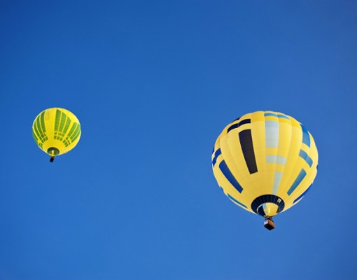 two hot air balloons in the air