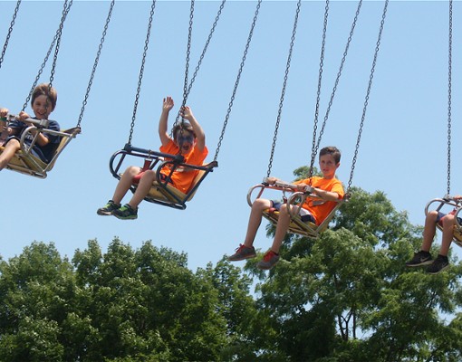 kids on a swing ride