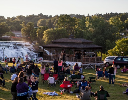 crowd by waterfall