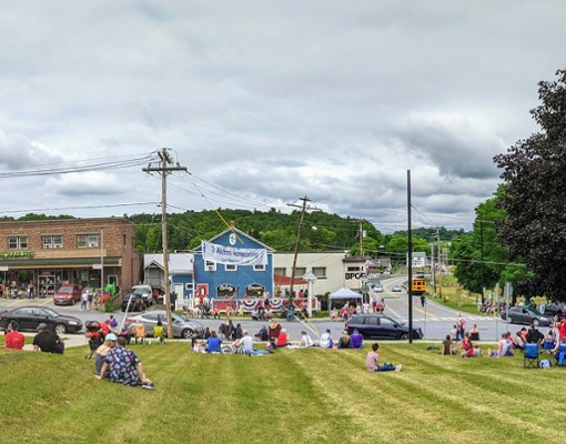 panoramic photo of crowd watching parade