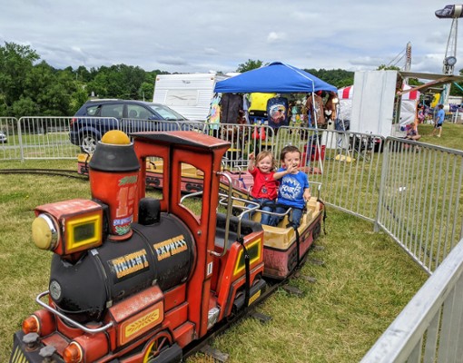 kids on carnival train ride