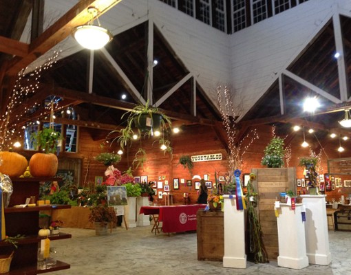 the inside of a large building with fall decorations
