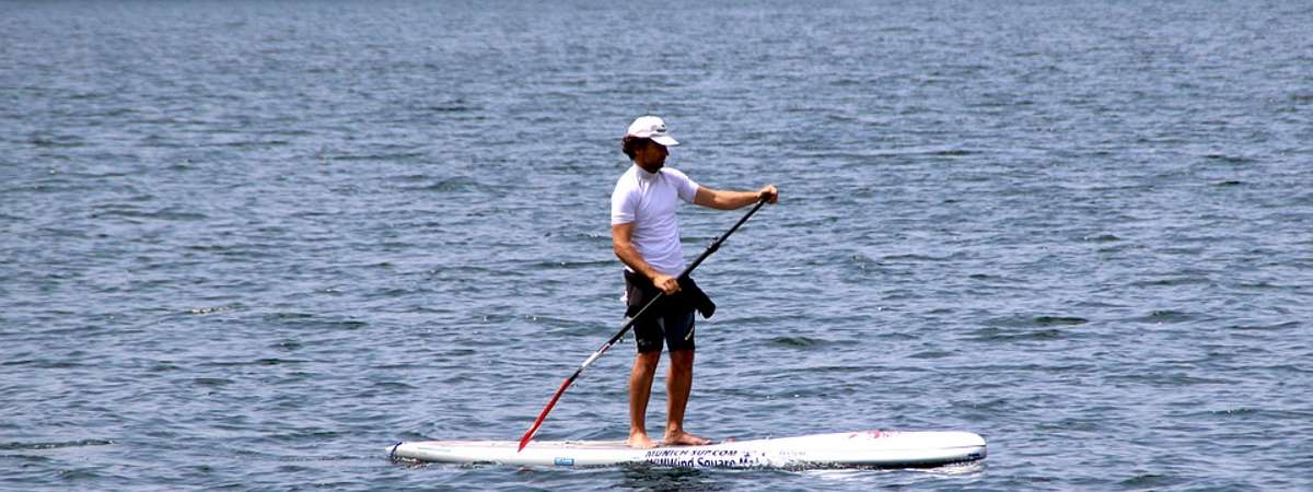 person on sup on lake