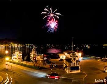 fireworks going off over lake george