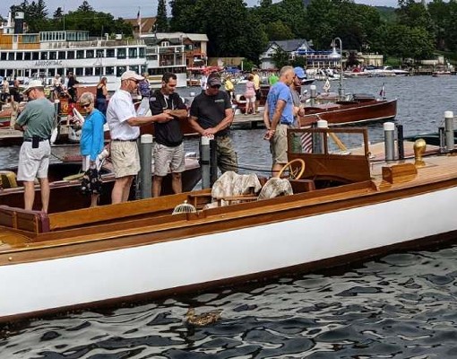 antique boat and people in water