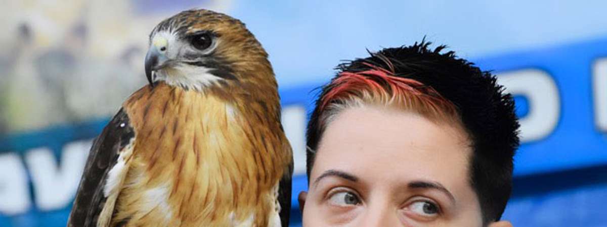 woman with large bird near her