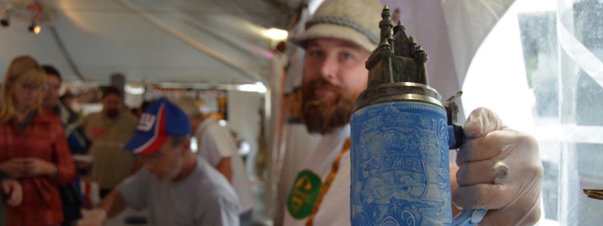 man holding beer stein