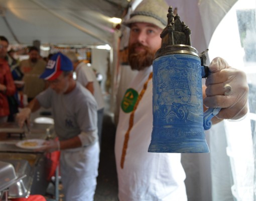 man holding beer stein