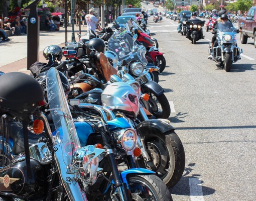 a row of parked motorcycles on a road