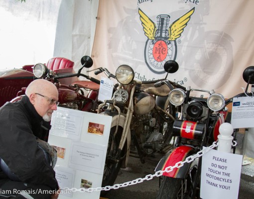 some motorcycles on display at an exhibition