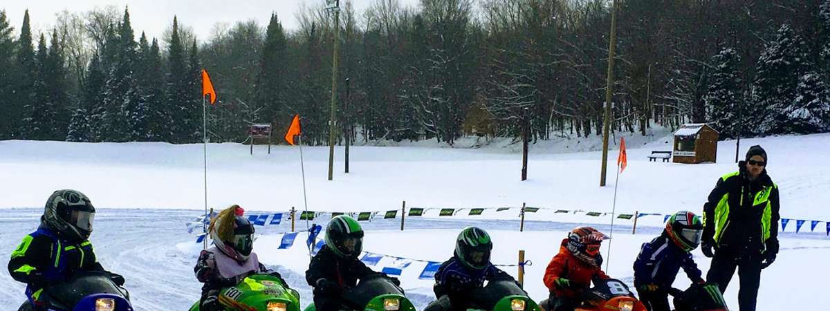 kids on snowmobiles lined up
