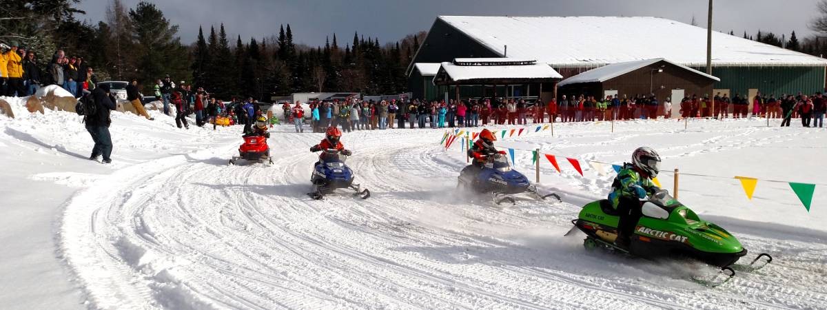 kids on snowmobiles race