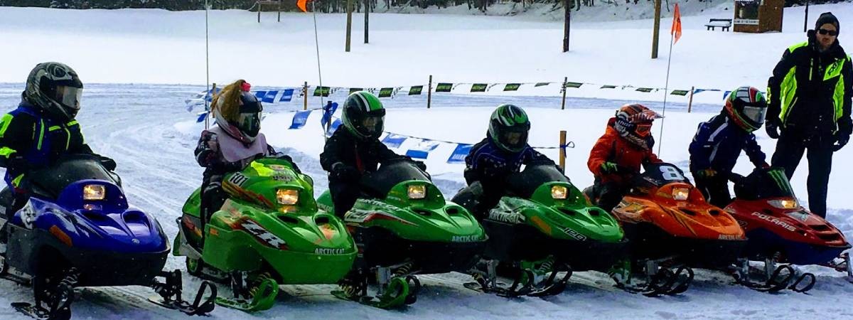 kids on snowmobiles