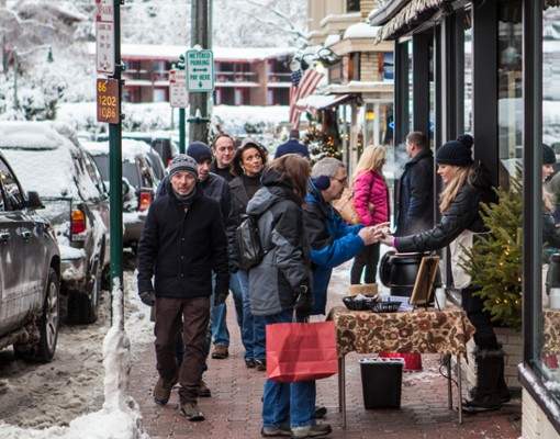 shoppers walking down a sidewalk