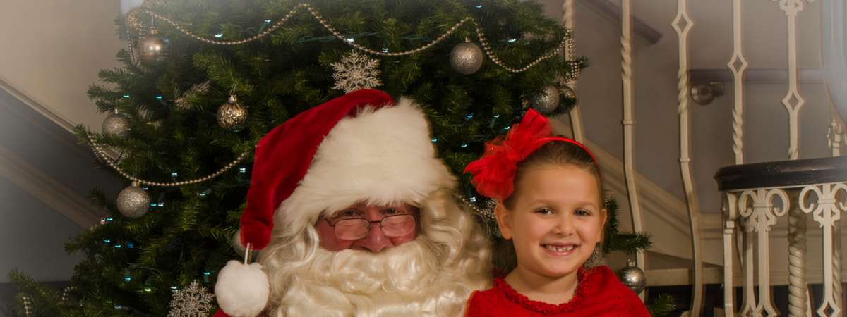 young girl with santa claus