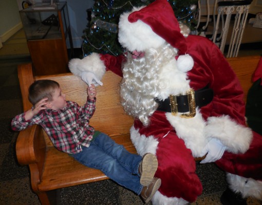 a child visiting with santa