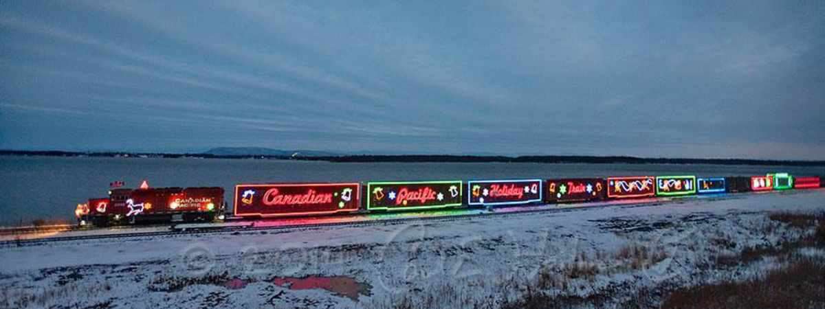 canadian pacific holiday train lit up at night