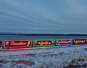 canadian pacific holiday train lit up at night