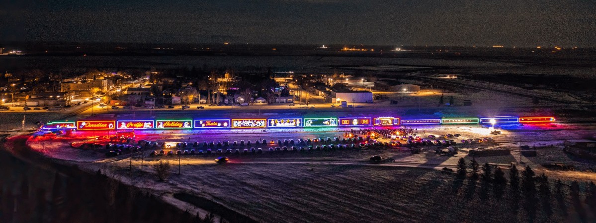 canadian pacific holiday train lit up at night