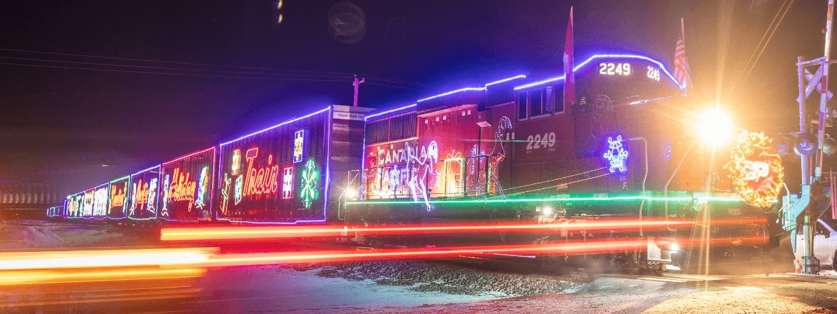 canadian pacific holiday train lit up at night