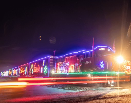 canadian pacific holiday train lit up at night