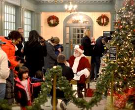 line up people waiting to meet santa