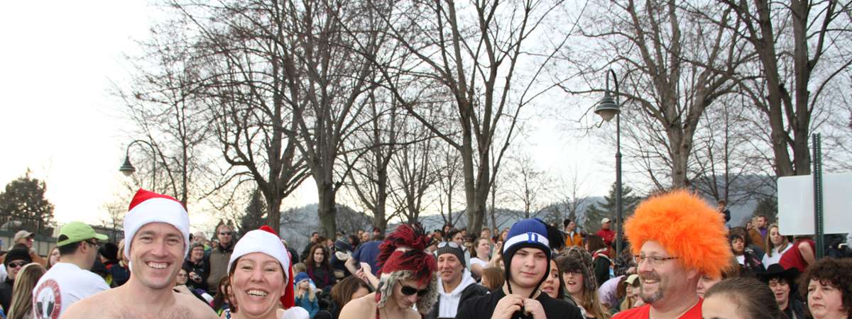 crowd of people dressed up for a fun polar plunge event