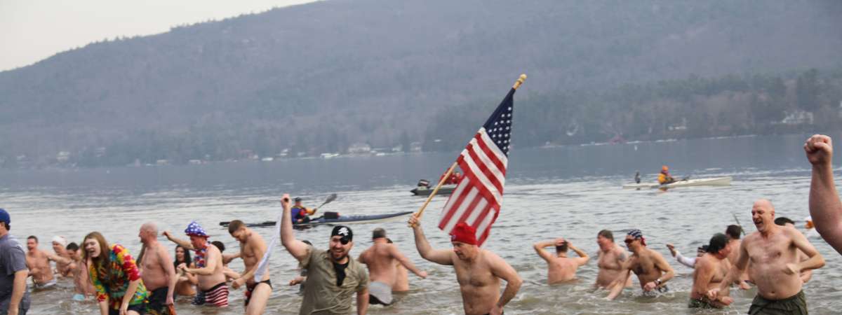 people in a lake for a polar plunge