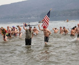 people in a lake for a polar plunge