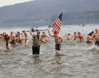 people in a lake for a polar plunge