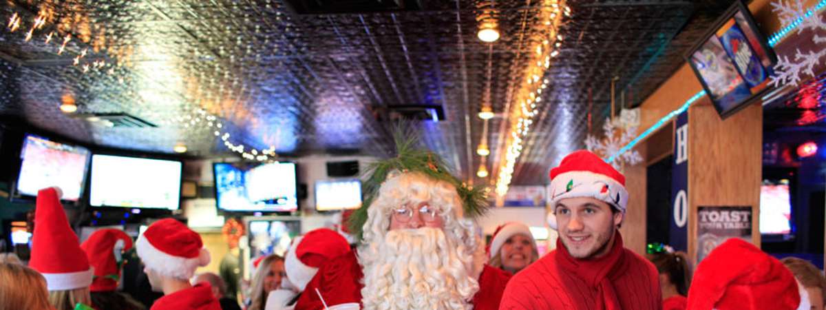 santa and people in holiday outfits