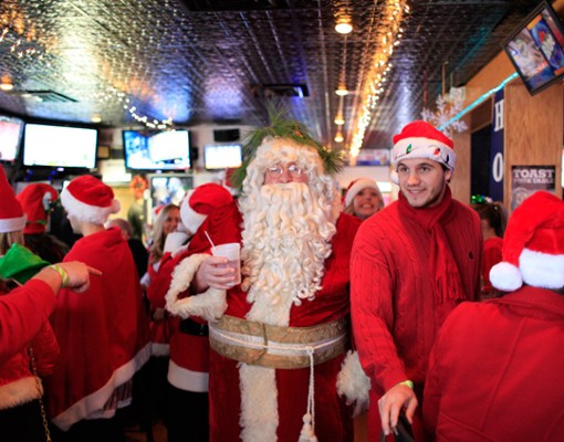 santa and people in holiday outfits