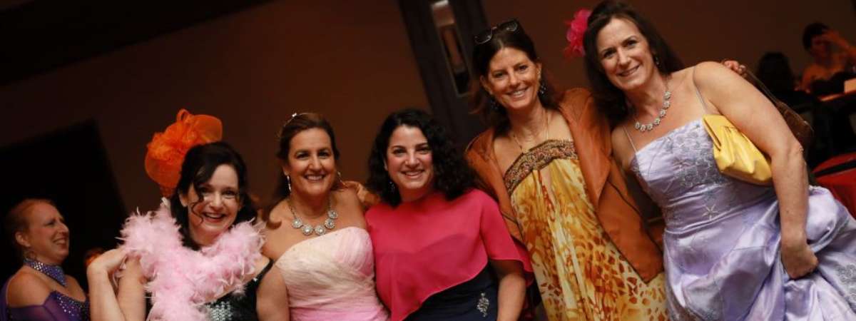 five women standing together for photo at a mom prom