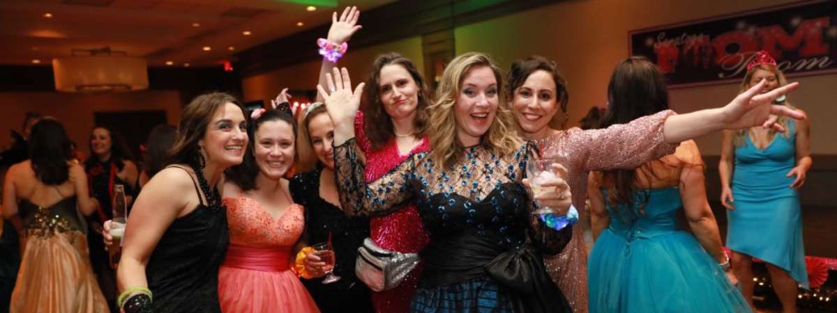 group of women posing for photo at a mom prom