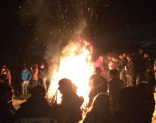 people around a large bonfire