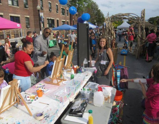 a street fair with people paitning