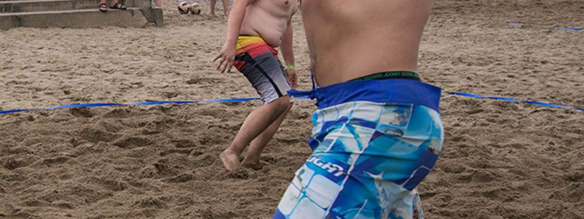 man about to hit a volleyball